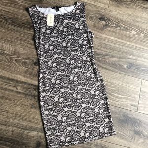 Lace pattern stretch fitted mini dress. NWT